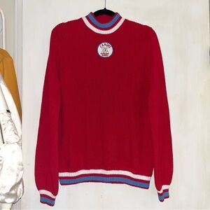 Retro look red knit sweater with a unique bunny badge design